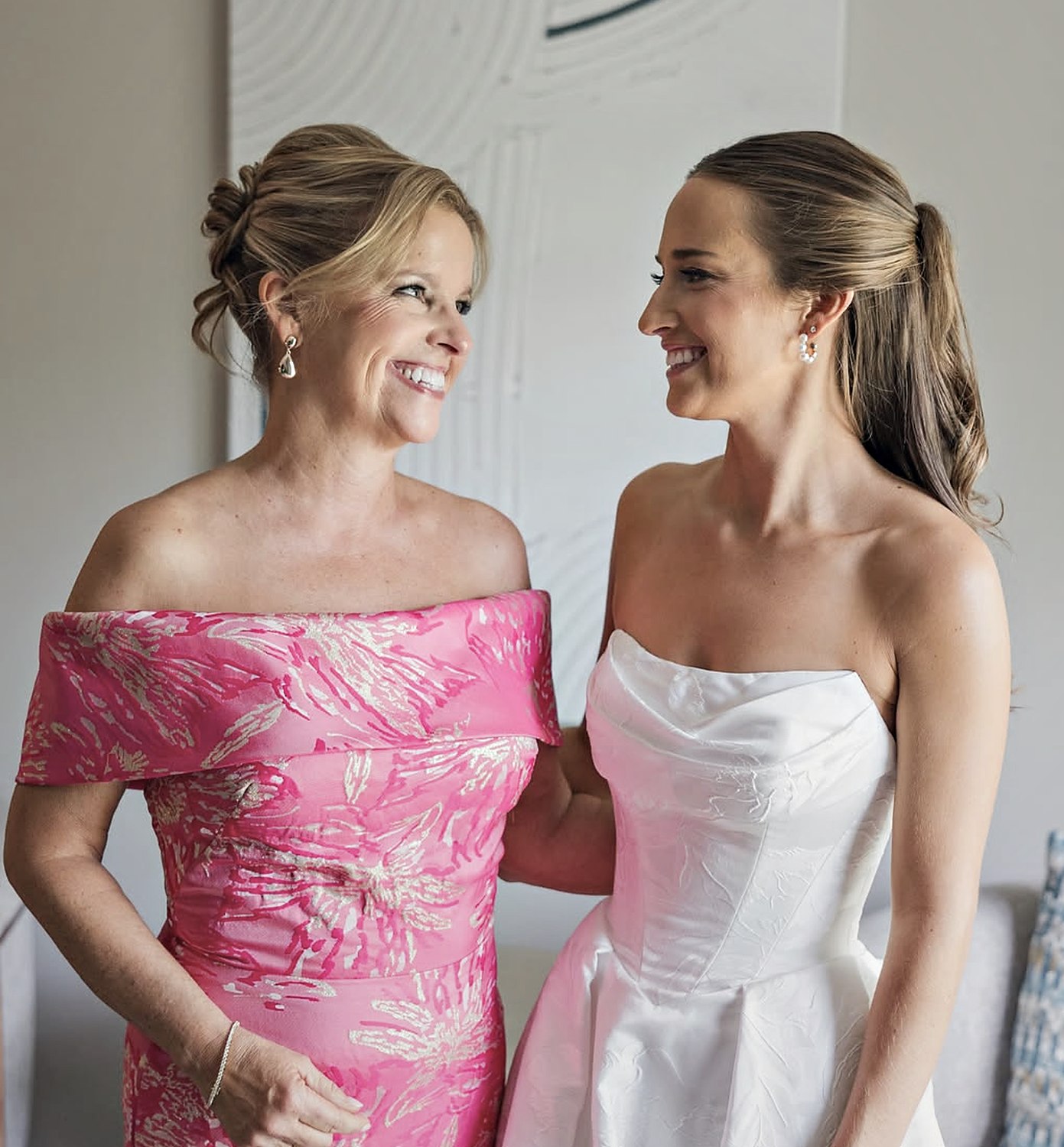 Bride and her mother sharing a moment before the ceremony